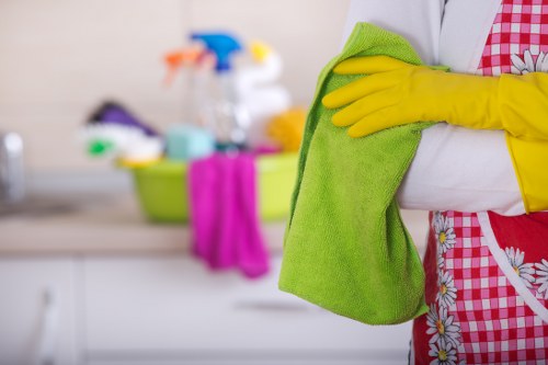 Technician applying safe carpet cleaning methods during a service visit