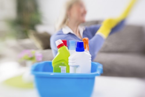 Cranham carpet cleaners working on a living room carpet with careful professional cleaning.