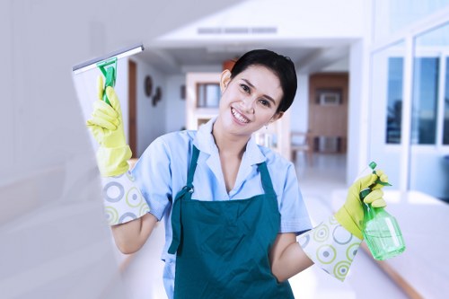 Employee lifting carpet cleaning equipment using safe manual handling